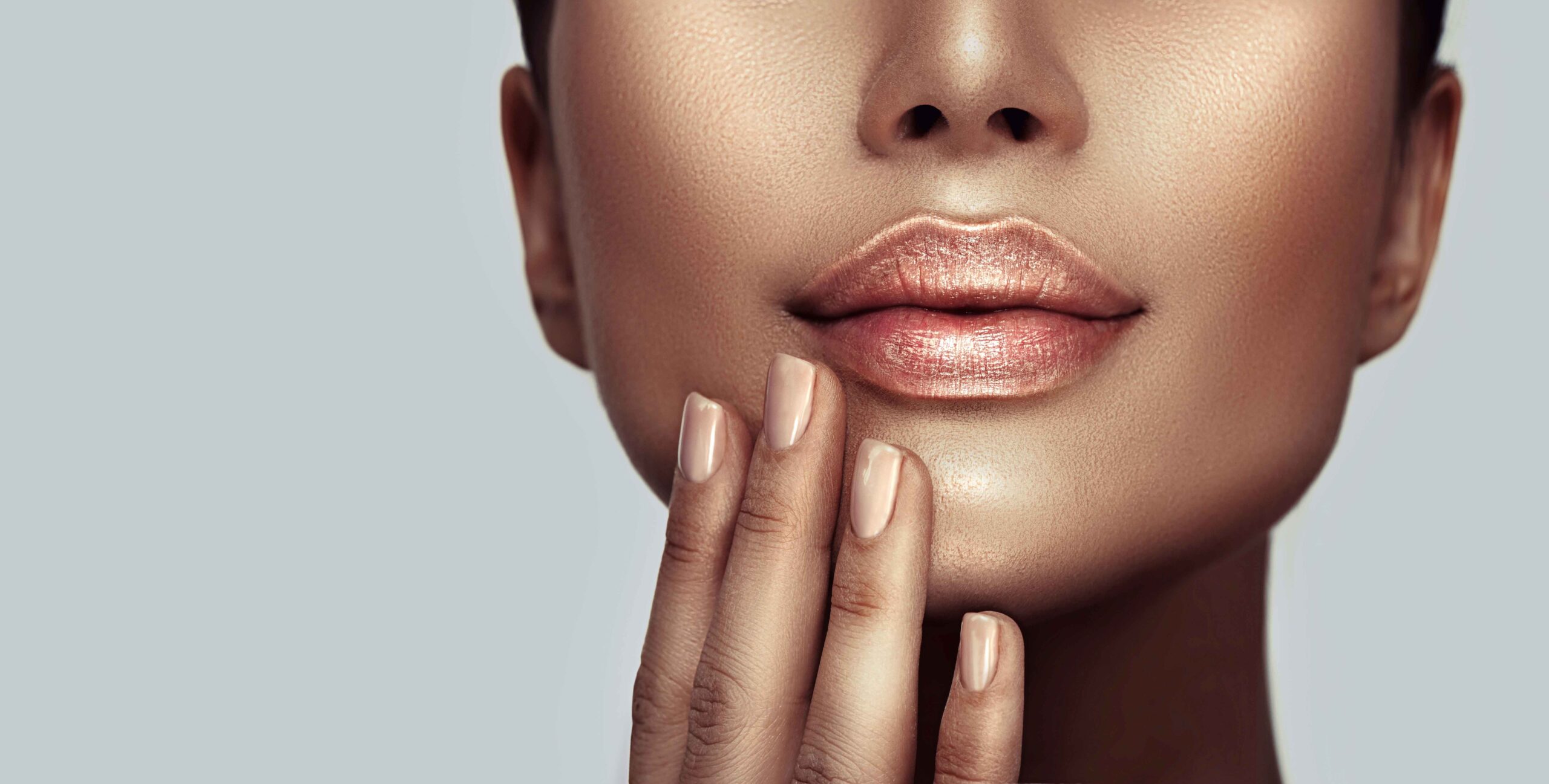 Close up of a woman with metallic rose lipstick